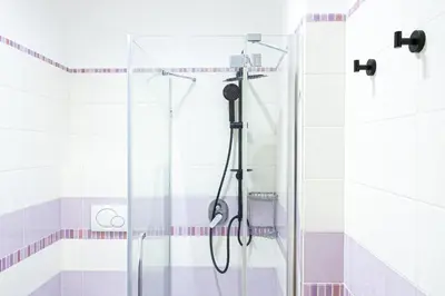 a shower with a glass door in a bathroom at Grace's house Roma Trastevere in Rome