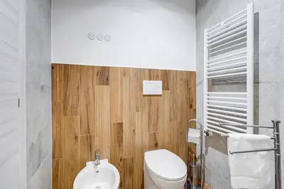 a bathroom with a toilet and a sink at BDC - Majestic 4-Bdr in Termini in Rome