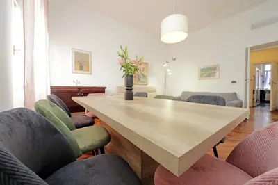 a dining room with a wooden table and chairs at 4BNB - Giant Giuliana Vatican Museum in Rome