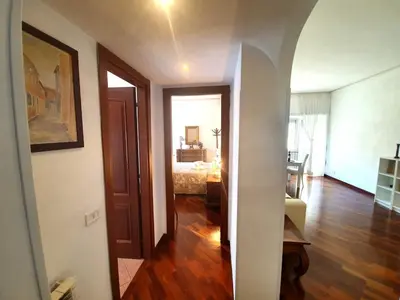a hallway leading to a bedroom with a bed in a room at Holiday apartment in Rome in Rome