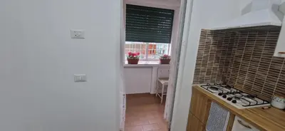 a kitchen with a stove and a window at Casa Nuccia,Close to Vatican city and Gemelli in Rome