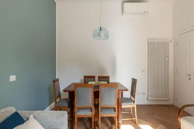 a dining room with a table and chairs at La casa di Oreste al Vaticano in Rome
