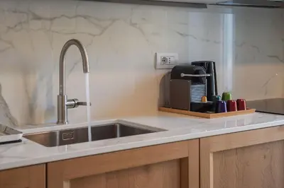 a kitchen with a sink and a counter top at La casa di Oreste al Vaticano in Rome