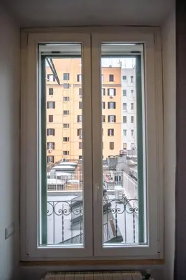 a window in a room with a view of a city at Collection39 Doria Smart Apartment in Rome