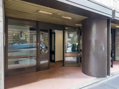 an entrance to a building with revolving glass doors at The Best Rent - Spacious Apartment Near Castel Sant’Angelo in Rome