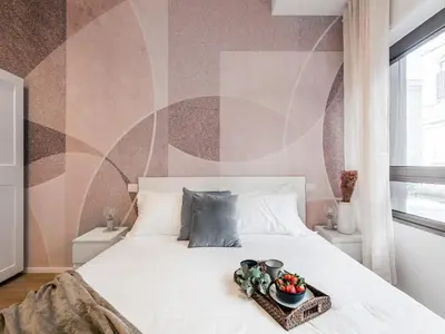 a bedroom with a bed with a bowl of fruit on it at The Best Rent - Spacious Apartment Near Castel Sant’Angelo in Rome
