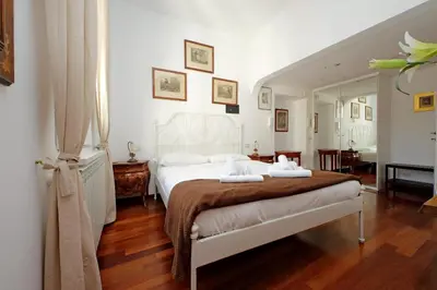 a bedroom with a bed with two towels on it at 4BNB - Navona Rooftop in Rome