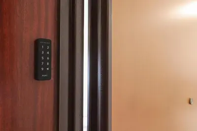 a close up of a remote control on a door at Apartments Portuense in Rome