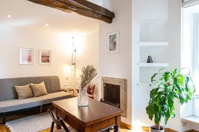 a living room with a couch and a table at Piazza Navona the most central apartment in Rome