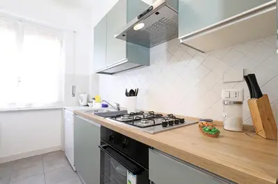 a kitchen with a stove and a counter top at Casa Cestia San Saba in Rome