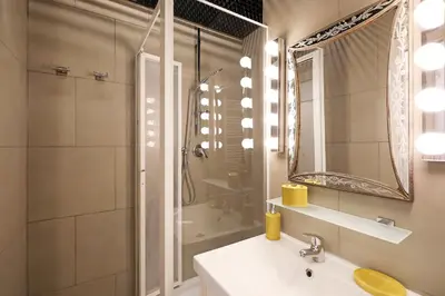 a bathroom with a sink and a shower at Casa Cestia San Saba in Rome