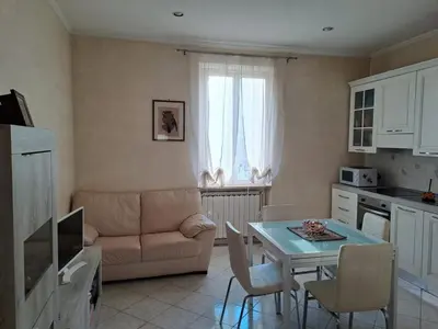 a living room with a table and a couch at Da Fedelisa in Rome