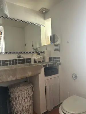 a bathroom with a sink and a toilet at Brina-House, Mini Apartment in Rome