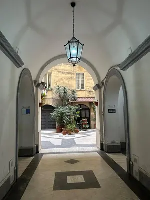 an archway with a light hanging from a building at Brina-House, Mini Apartment in Rome