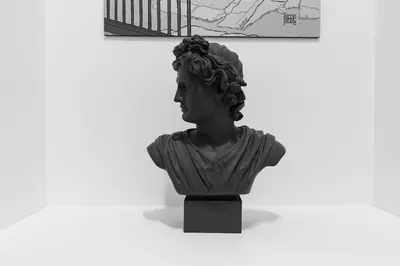 a bust of a woman sitting next to a wall at Casa vacanze Alle Mura Aureliane in Rome