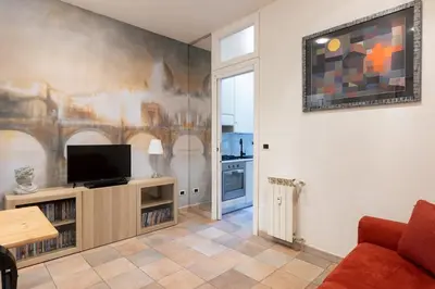 a living room with a flat screen tv on a wall at Casa vacanze Alle Mura Aureliane in Rome