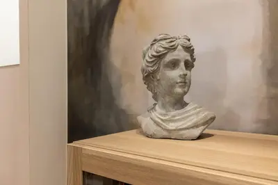 a statue of a bust of a woman sitting on a shelf at Casa vacanze Alle Mura Aureliane in Rome