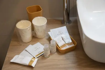 a bathroom with a toilet and some bottles and towels at Casa Vacanze Fausta in Rome