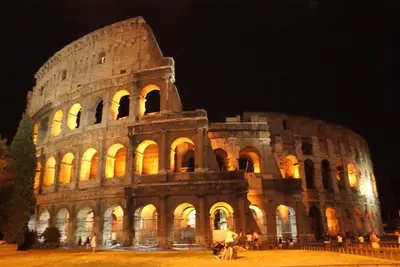 a large building is lit up at night at Casa Kathy Rome in Rome