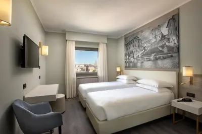 a hotel room with a bed and a window at Hotel Marc'Aurelio in Rome