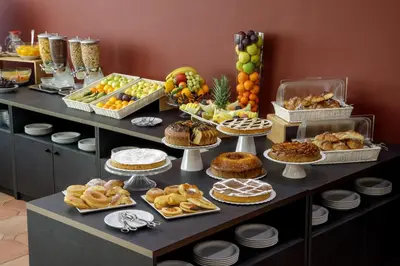 a table filled with lots of different types of food at Hotel Marc'Aurelio in Rome