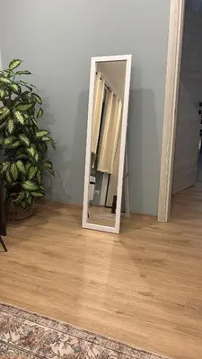 a mirror sitting on a wooden floor in a room at Suite dell'Arte - Metro linea A in Rome