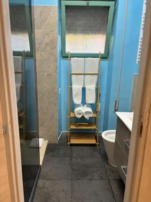 a bathroom with a toilet and a sink at Suite dell'Arte - Metro linea A in Rome