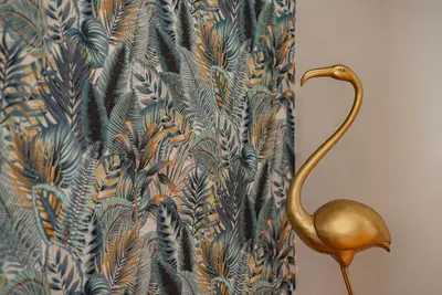 a shower curtain with a gold flamingo design at Along the Tiber Apartment in Rome