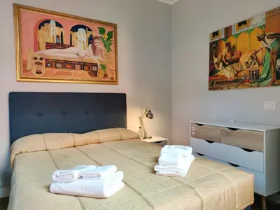 a bedroom with a bed with towels on it at Domus Monamì Dreams & Terrace in Trastevere in Rome