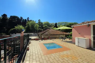 a patio with a swimming pool and a house at Domus Monamì Dreams & Terrace in Trastevere in Rome