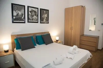 a bedroom with a large bed with towels on it at Vatican - Risorgimento's Homies in Rome