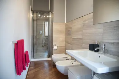 a bathroom with a sink and a toilet and a shower at Roma Vatican-Ottaviano's Homies in Rome
