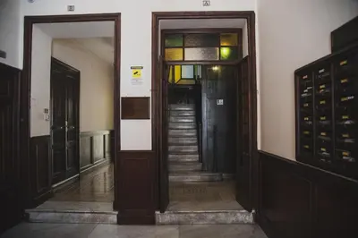 a hallway with doors and stairs in a building at Roma Vatican-Ottaviano's Homies in Rome