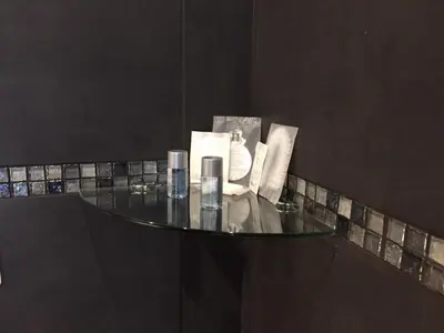 a glass table with some items on top of it at Rome Key Luxury House in Rome