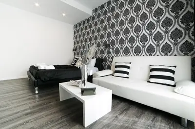 a living room with a white couch and a table at Rome Key Luxury House in Rome