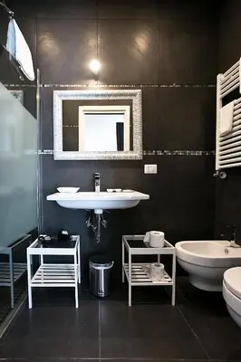 a bathroom with a sink and a toilet and a tub at Rome Key Luxury House in Rome