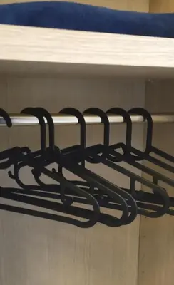 a row of black metal objects on a shelf at Parrot Room - Camera a Roma con bagno privato in Rome