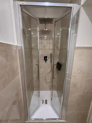 a shower with a glass door in a bathroom at Antica Dimora Luxury in Rome