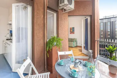 a dining room with a table and chairs at Pop Studio Trastevere in Rome