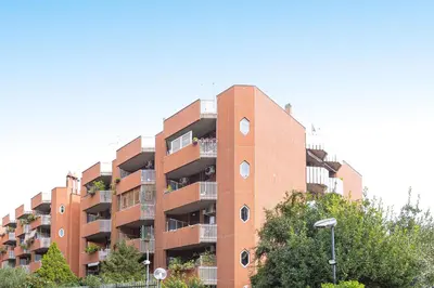 a red brick apartment building with balconies at Pop Studio Trastevere in Rome