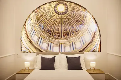 a bedroom with a bed with a large ceiling at Casa di borgo in Rome