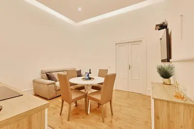 a kitchen and dining room with a table and chairs at Casa di borgo in Rome