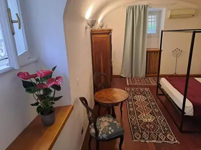 a bedroom with a bed and a table and chairs at Romeo&Giulietta in Rome