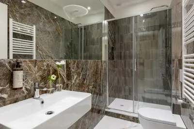 a bathroom with a sink and a shower at Casa Gold by Hili in Rome