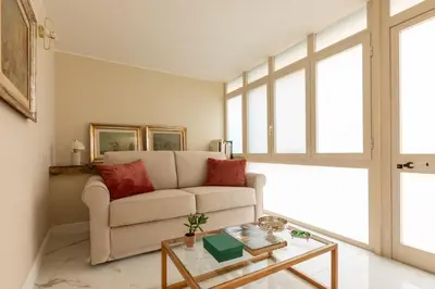a living room with a couch and a table at Casa Gold by Hili in Rome