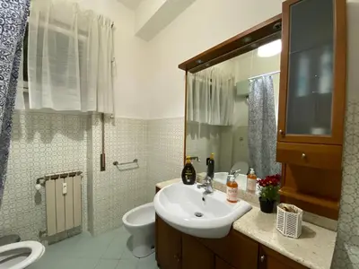 a bathroom with a sink and a toilet at Tiburtina2000 in Rome