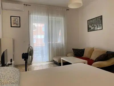 a living room with a couch and a living room at Tiburtina2000 in Rome