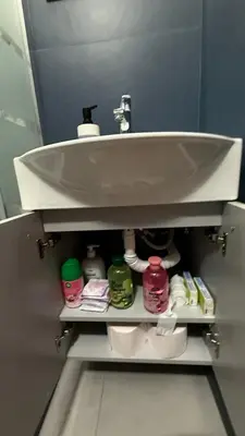 a bathroom with a sink and toiletries underneath it at Lucian Dreams roma in Rome