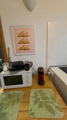 a kitchen with a microwave and a plate on top of it at Lucian Dreams roma in Rome