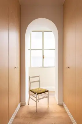a chair in a room with a window at Idyllia - Casa Mina in Rome